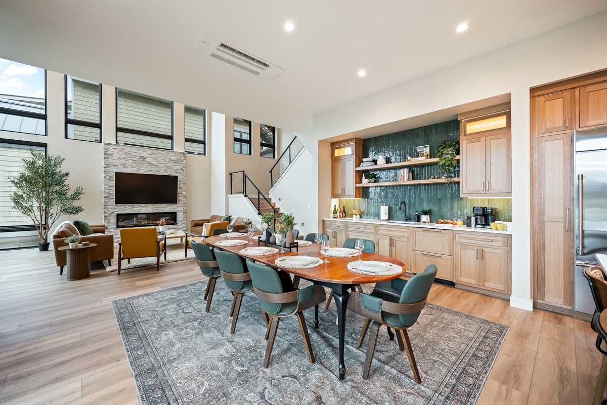 Main floor open concept living room, dining area, kitchen and wet bar and packed with lake view & glass wall sliding doors. Dining table has several extendable leaves and extra chairs to seat up to 12.