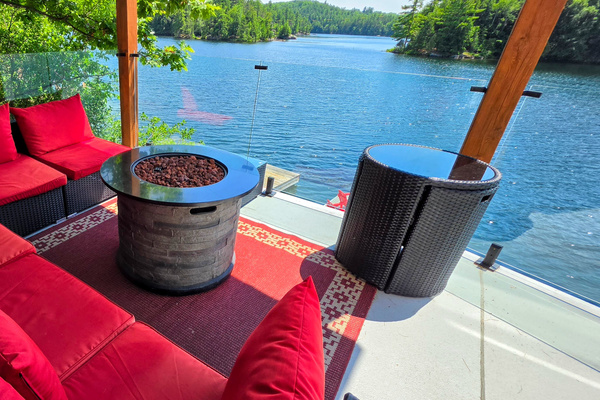 Upper balcony seating and fire pit area overlooking Lac McGregor