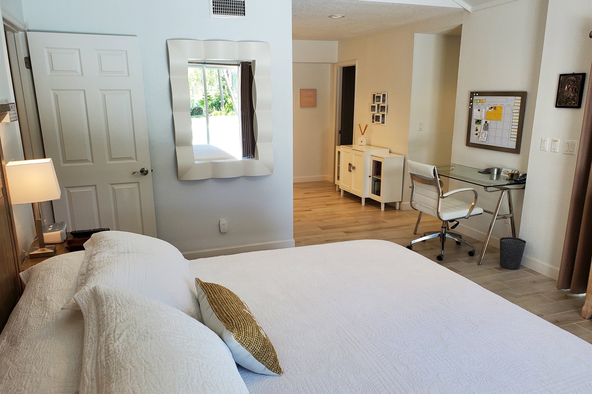 Master King bedroom with view of office and private bathroom