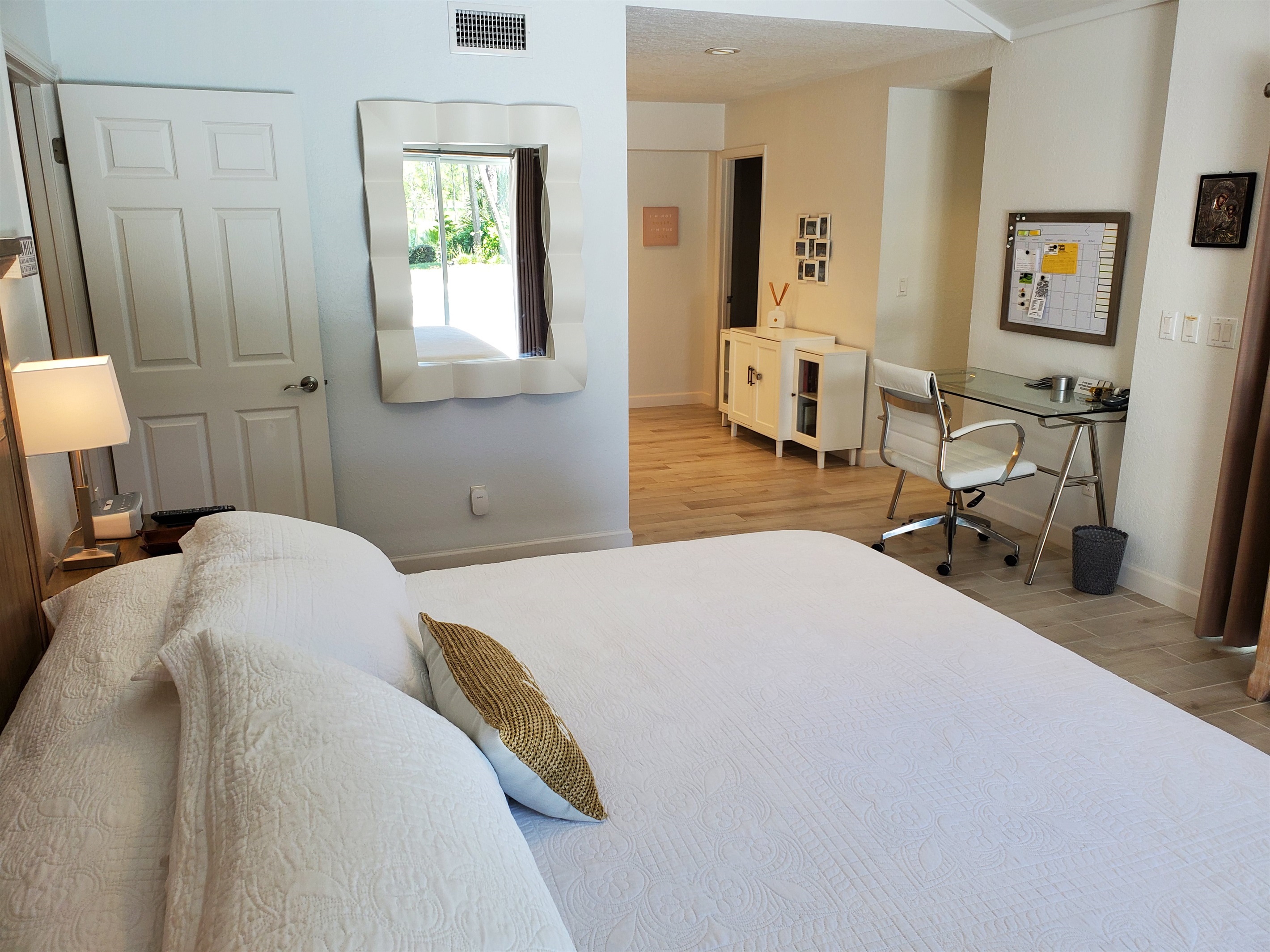 Master King bedroom with view of office and private bathroom