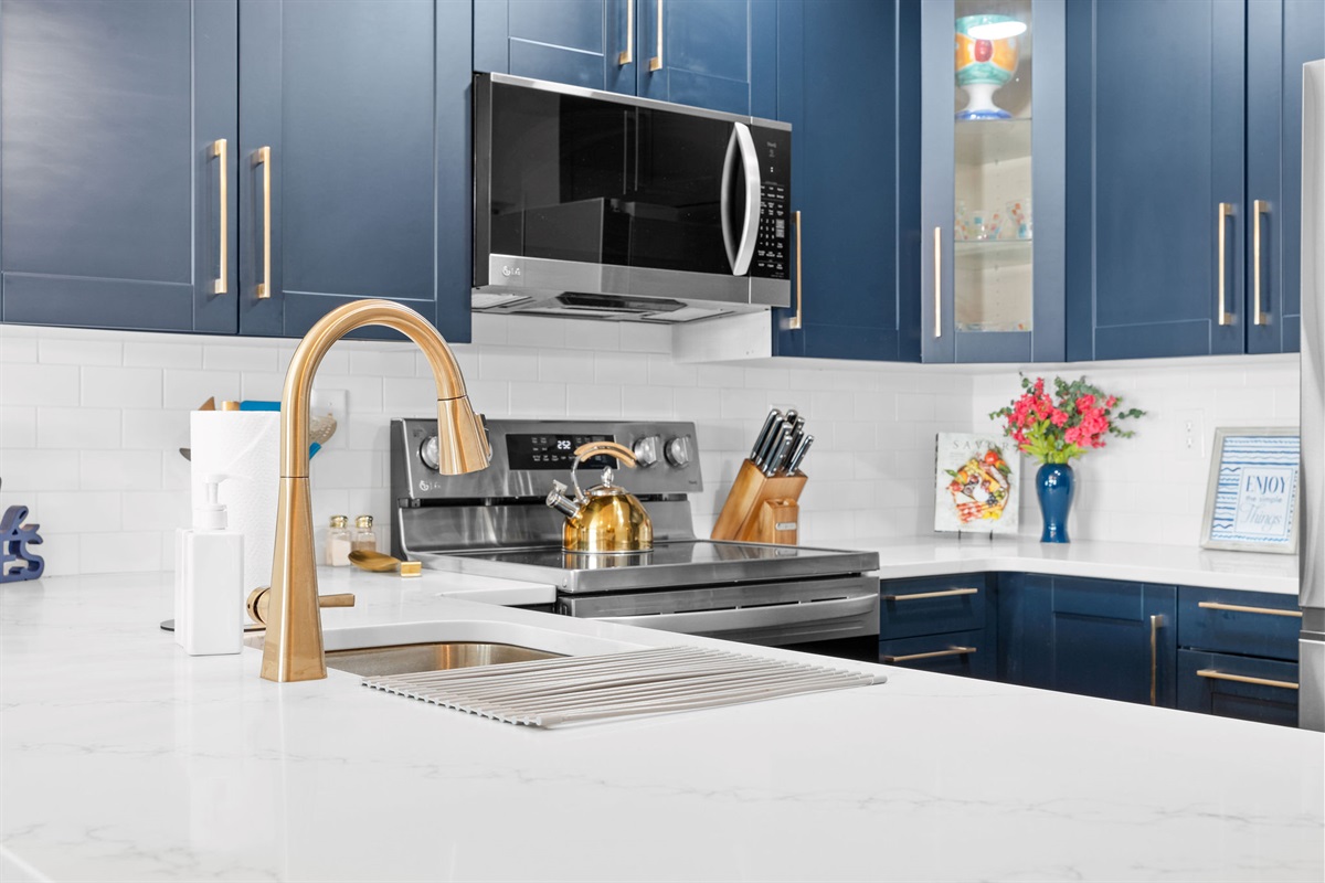 Fully equipped stainless steel kitchen.