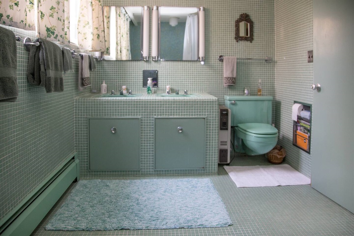 Custom Tile Bathroom with dual sinks. Shot from sunken shower.