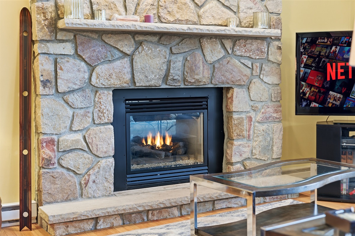 Living room with the Roku TV and fireplace