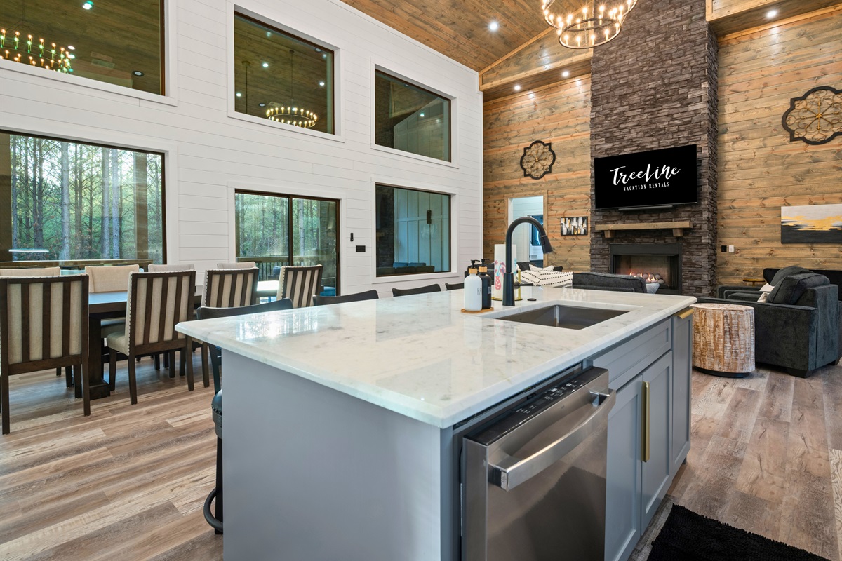 The large kitchen island offers plenty of room for prepping meals, enjoying morning coffee, or chatting while dinner comes together.