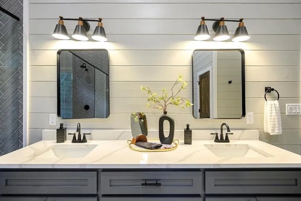 Double vanity setup with sleek fixtures and ample counter space.