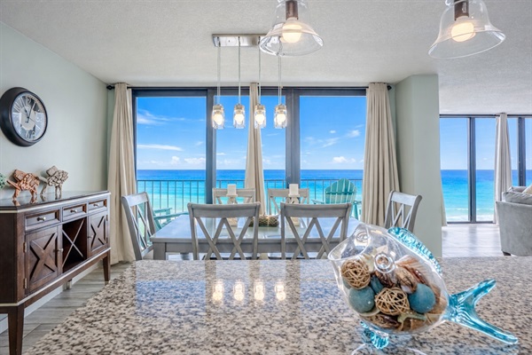 Dining with a view! Looking over our island to the dining table and balcony
