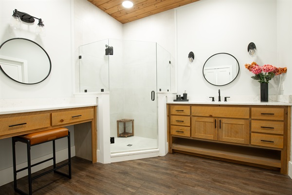 King Suite 3 Bath | Dual vanities and glass walk-in shower in a refined, modern space
