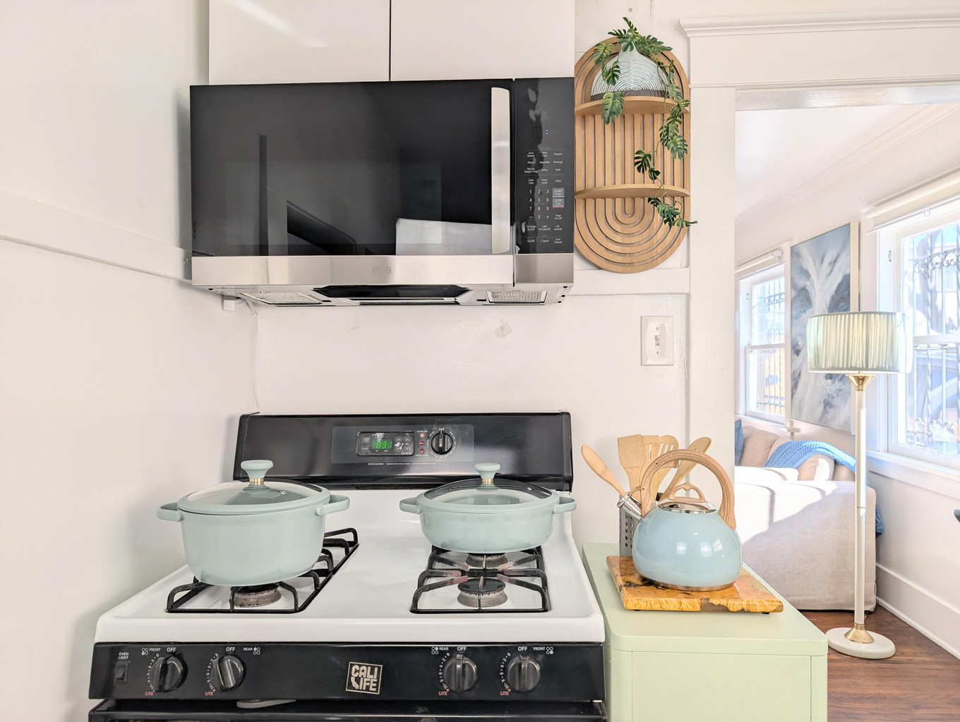 Full kitchen with gas stove, microwave, and cooking essentials.
