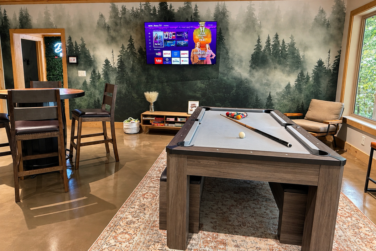 Game room with ping pong topper over pool table and pub table