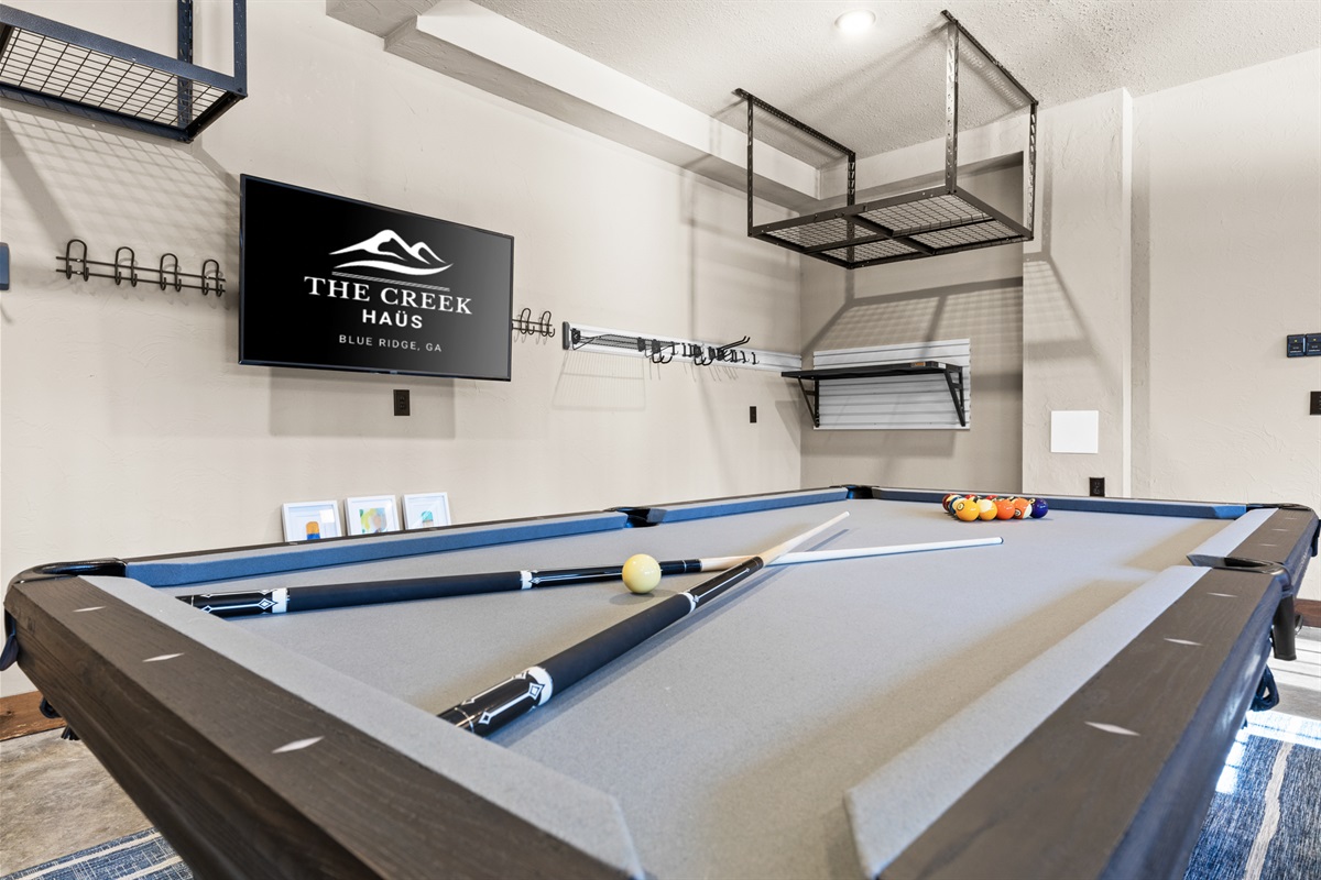 Another angle of the game room highlights its spacious design and variety of games for all ages to enjoy.