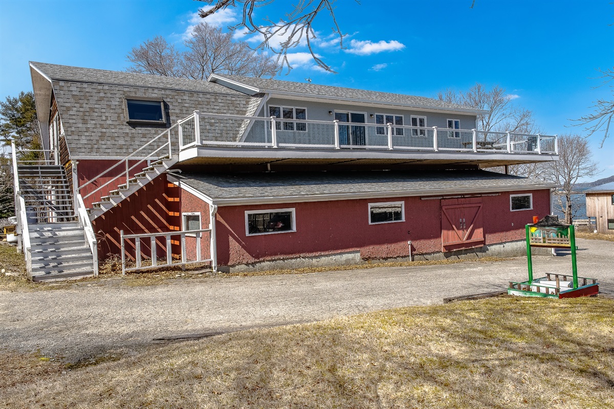 Rising above the harbor, the Phoenix Aerie features a private entrance and a massive 75-foot wrap-around deck. This historic maritime loft offers an elevated perspective on Southwest Harbor, providing unparalleled outdoor space for your group of nine.