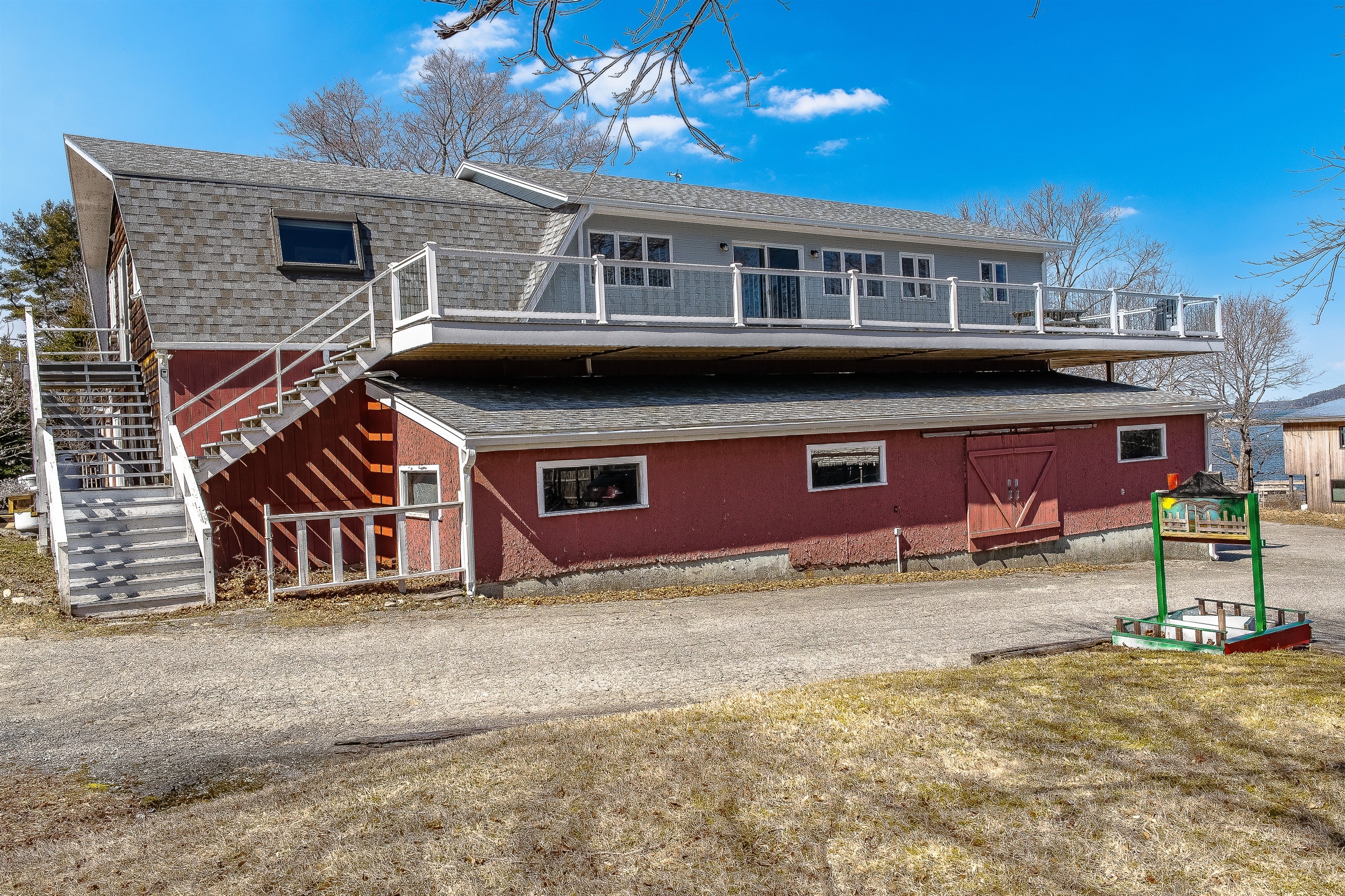 Rising above the harbor, the Phoenix Aerie features a private entrance and a massive 75-foot wrap-around deck. This historic maritime loft offers an elevated perspective on Southwest Harbor, providing unparalleled outdoor space for your group of nine.