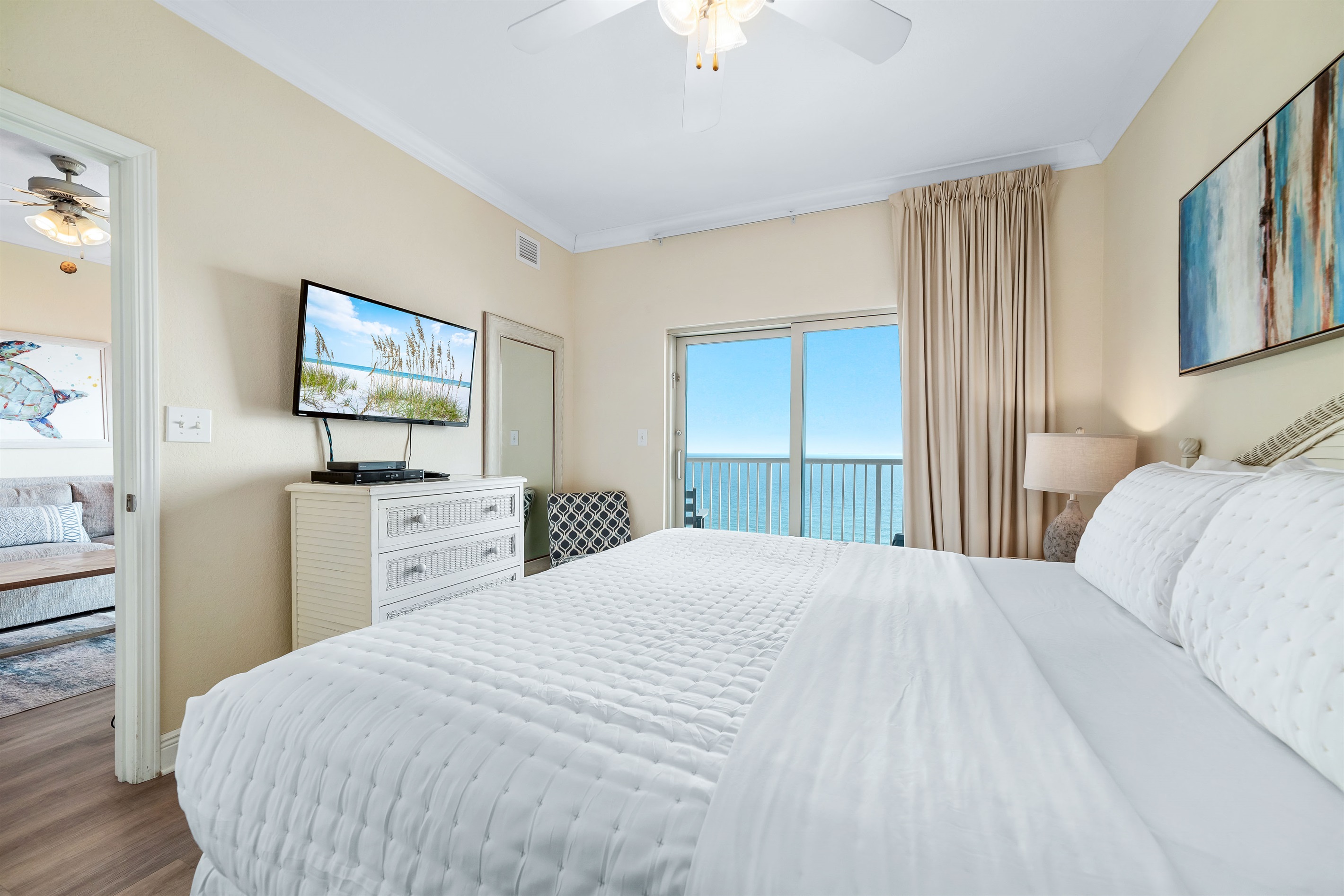 Wake up to stunning Gulf views from this comfortable bedroom with direct balcony access. Perfect for a relaxing vacation.
