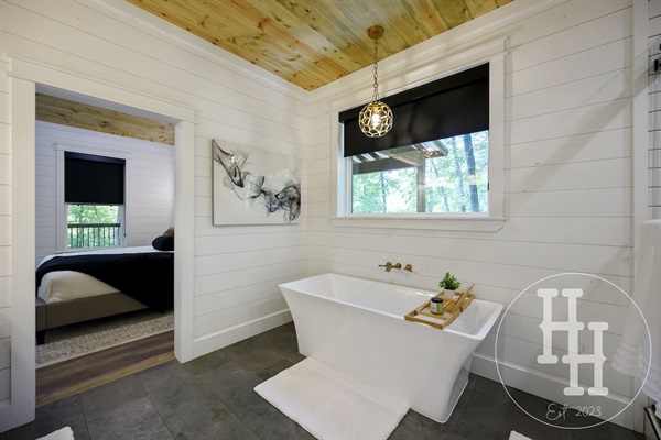 Enjoy our large bath tub with a tray for your favorite book and beverage.
