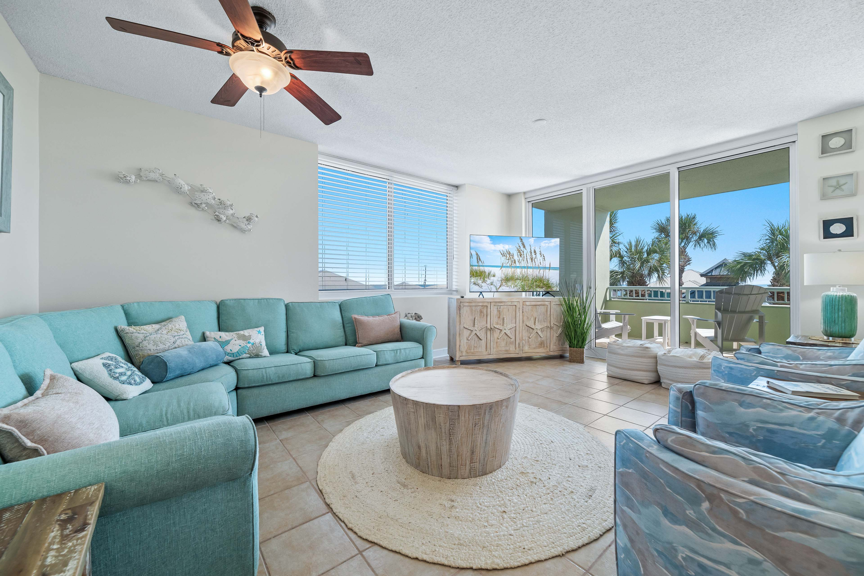 Relax and unwind in this bright and airy living space with seamless balcony access.