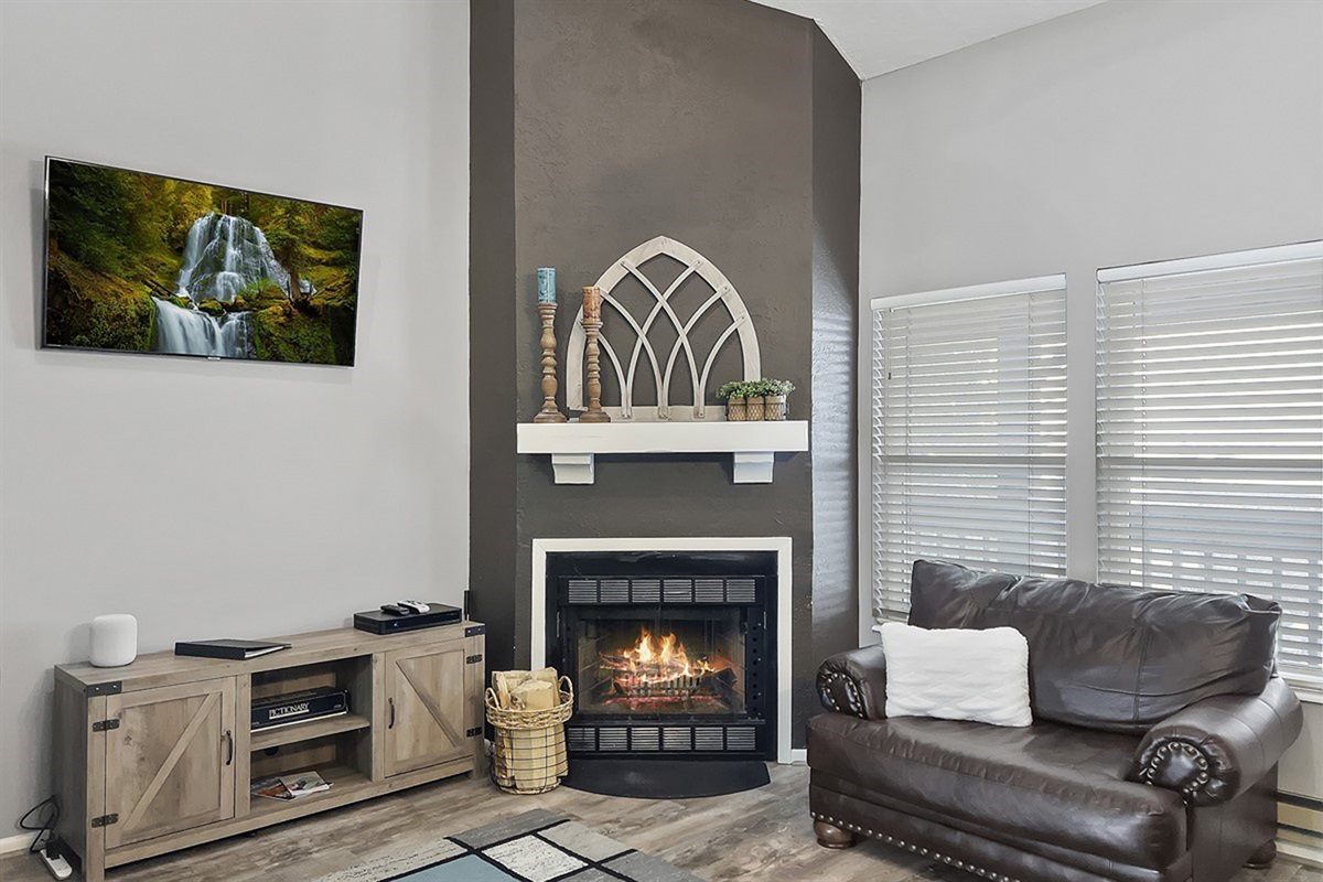 Warm up by the fireplace in this inviting living room—perfect for après-ski evenings.