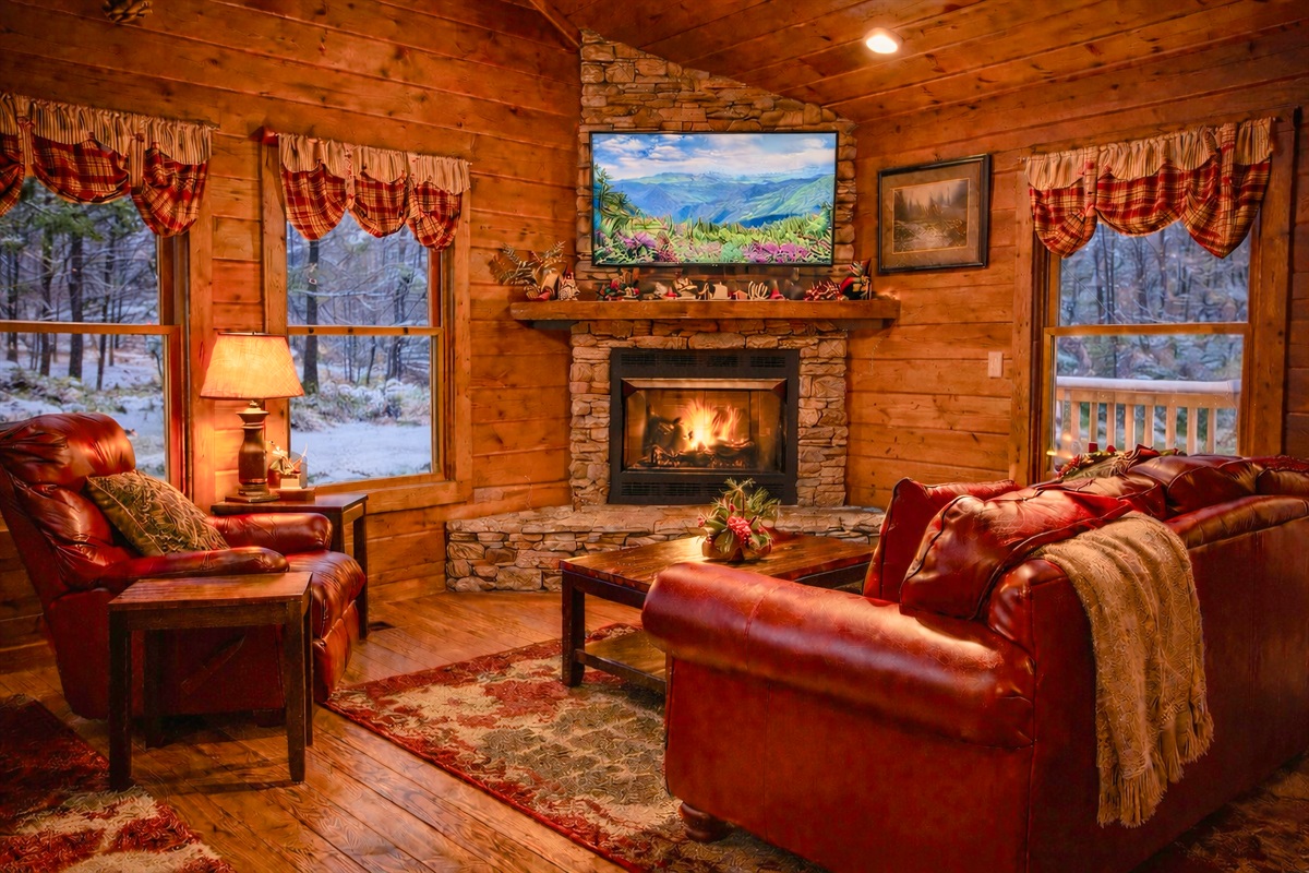 This is the place to be on a crisp Winter day; a fireplace  giving off warmth while you relax, watch TV, read, or just listen to music.  Note: snow is actually a rare occurance in the Smokies and this is an Illustrative winter rendering.