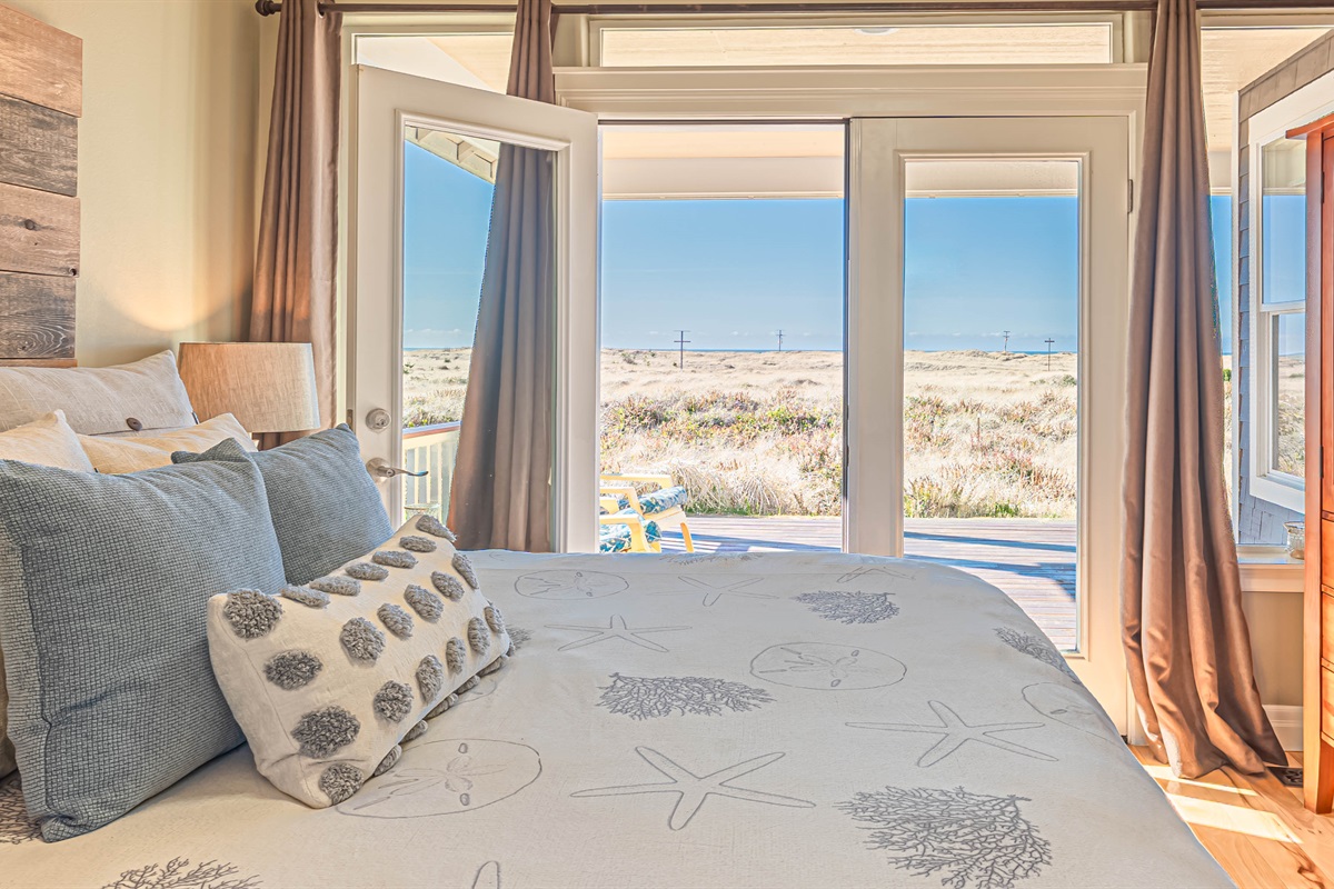 This bedroom has French doors leading out to private deck space and amazing ocean views!