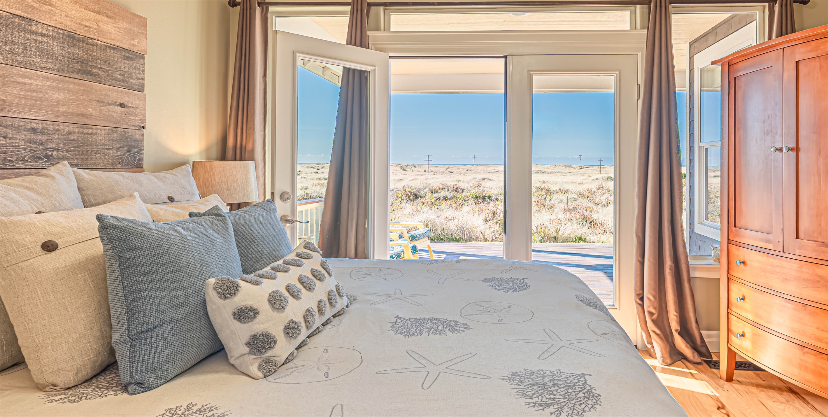 This bedroom has French doors leading out to private deck space and amazing ocean views!