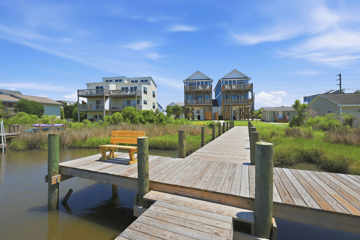 From the dock, enjoy tranquil water views and easy access to the scenic marshfront setting