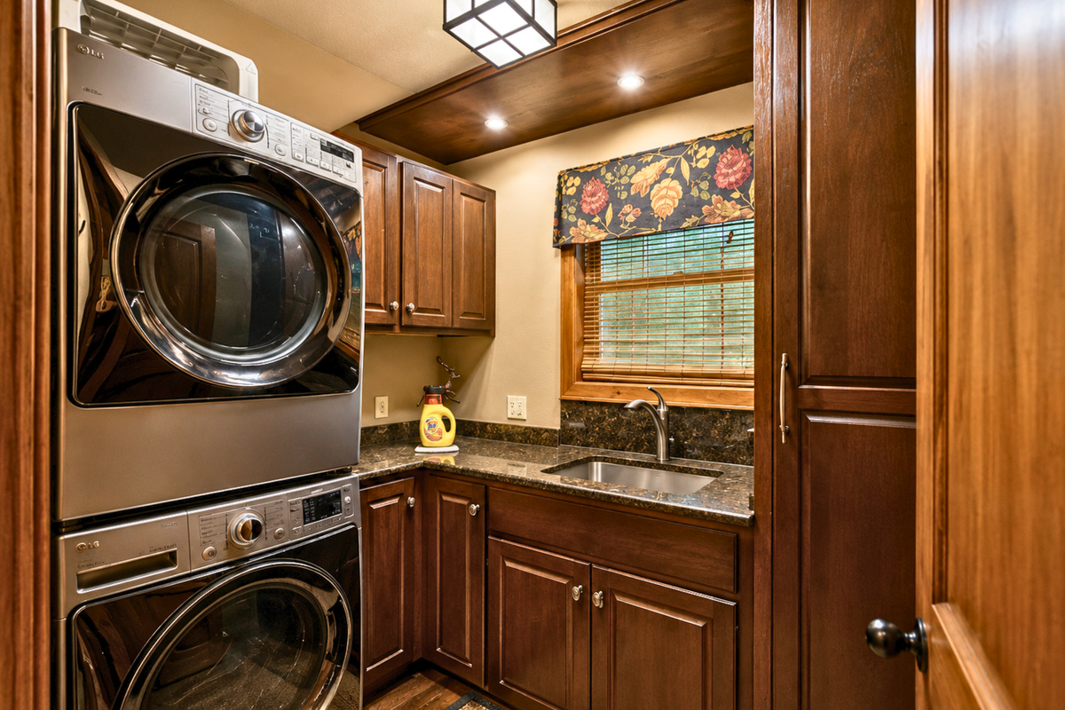 A dedicated laundry area with a full-size washer and dryer makes longer stays and post-adventure cleanup much more convenient.