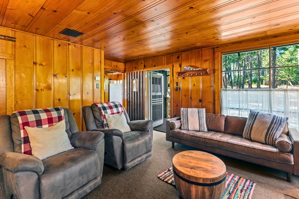 Classic cabin living with comfy seating and plenty of space to stretch out and relax after a day outdoors.