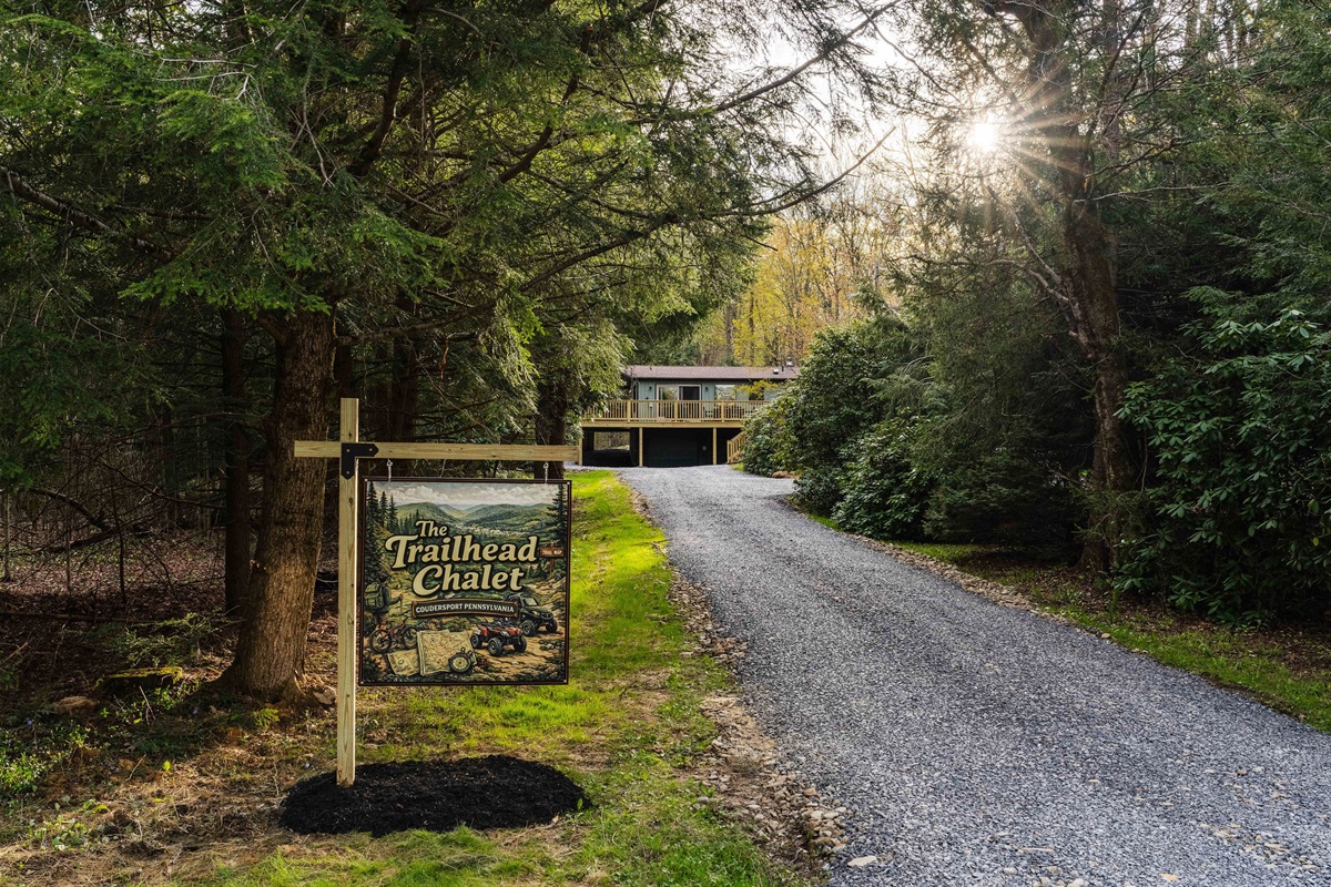 🪧 The Trailhead Chalet sign marks your turn off the historic Route 6 scenic byway.