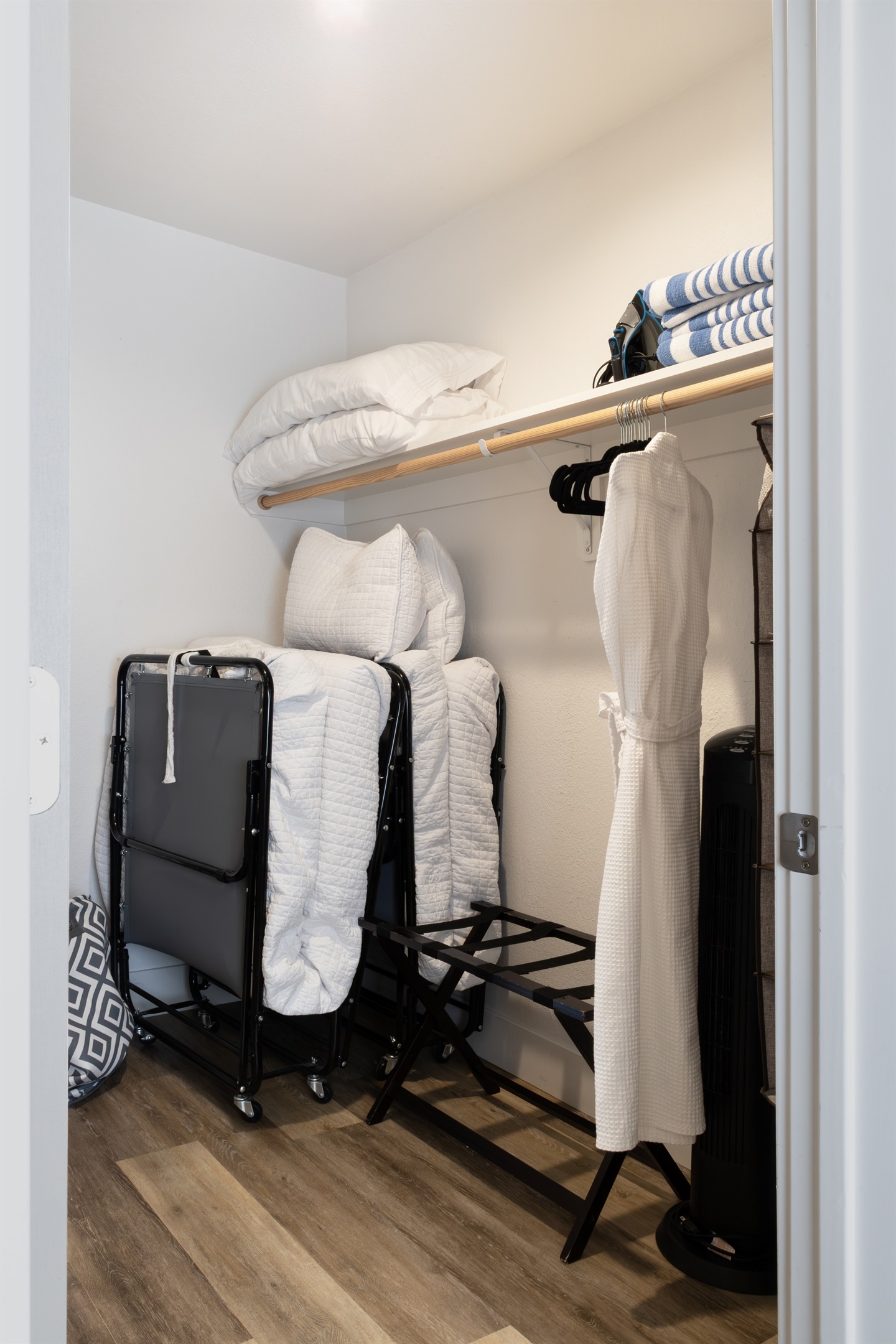 Every comfort accounted for — extra linens, plush robes, a rollaway bed, and luggage racks are all tucked away and ready for whatever your stay requires.