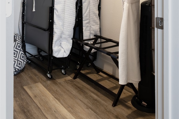 Every comfort accounted for — extra linens, plush robes, a rollaway bed, and luggage racks are all tucked away and ready for whatever your stay requires.