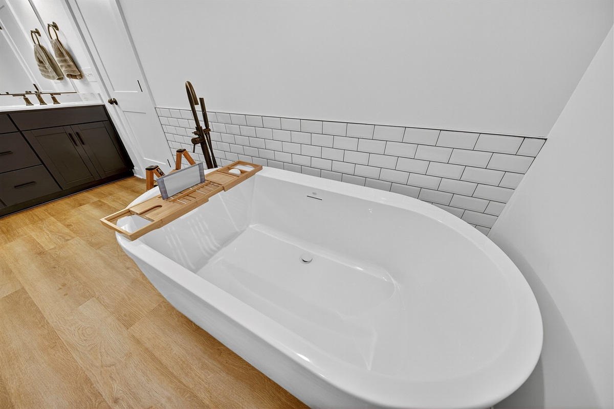 Indulge in a long soak with your favorite book or glass of wine—this freestanding tub is made for moments of pure tranquility.