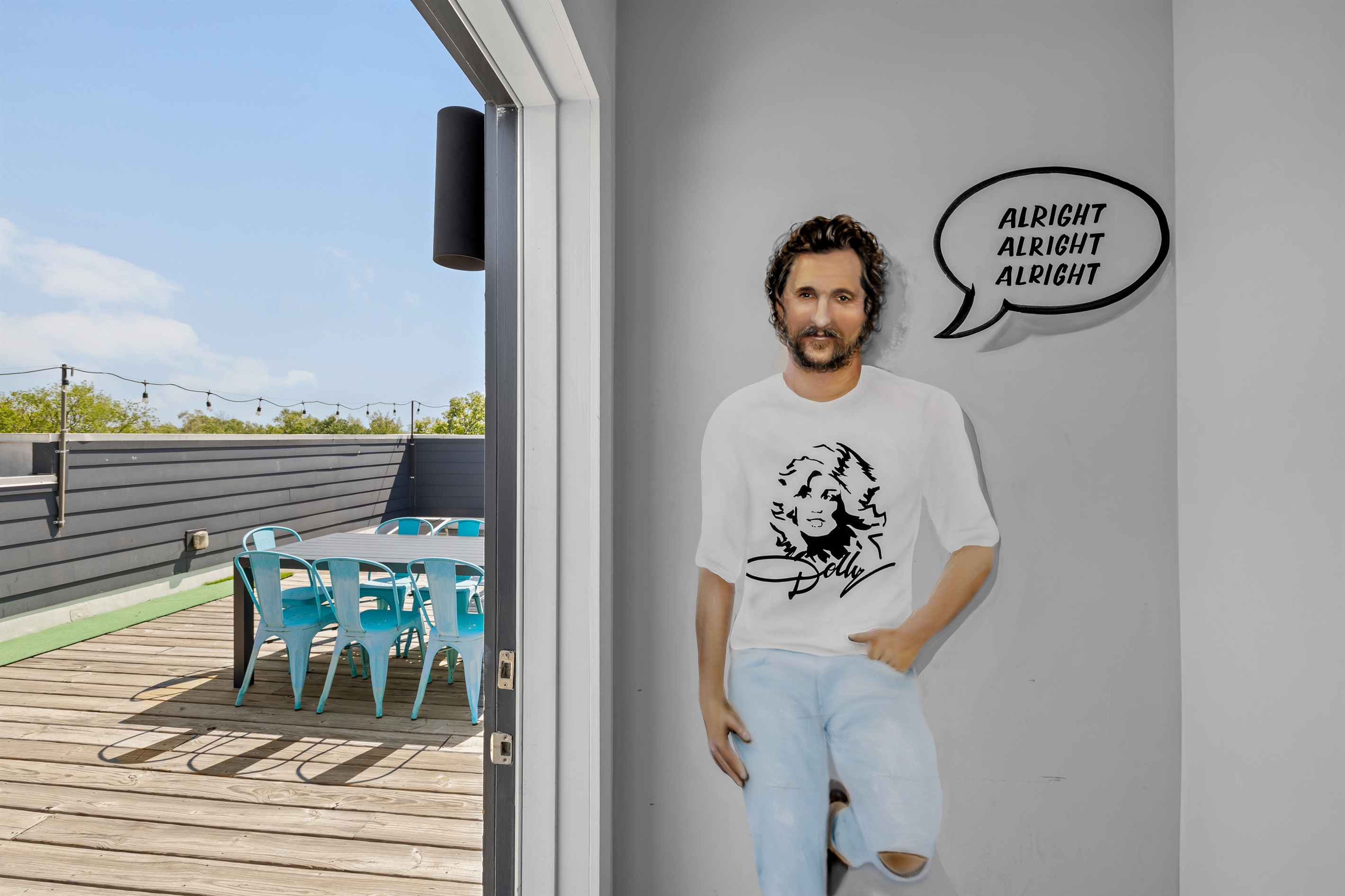 Rooftop Retreat: Enjoy fun gatherings on the sunny deck with vibrant seating and skyline views!