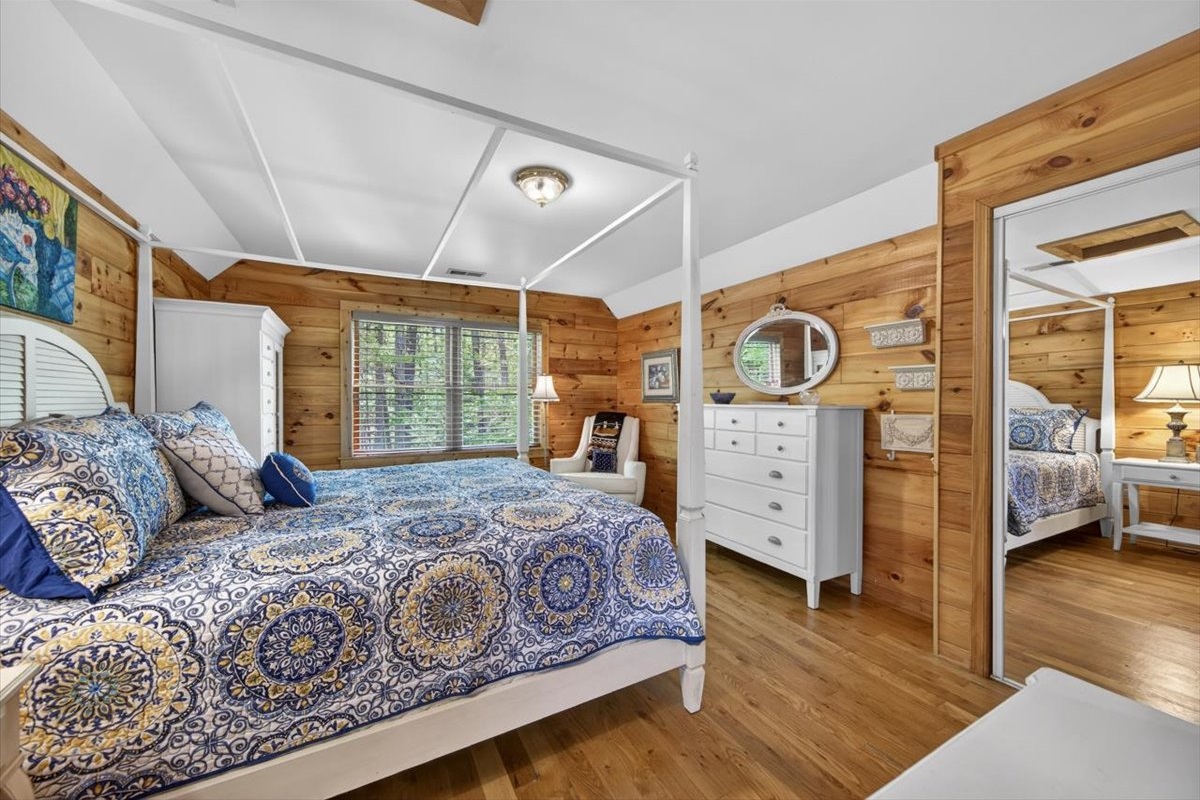 King suite on the upper level, thoughtfully designed for comfort and relaxation after a day on the lake. 