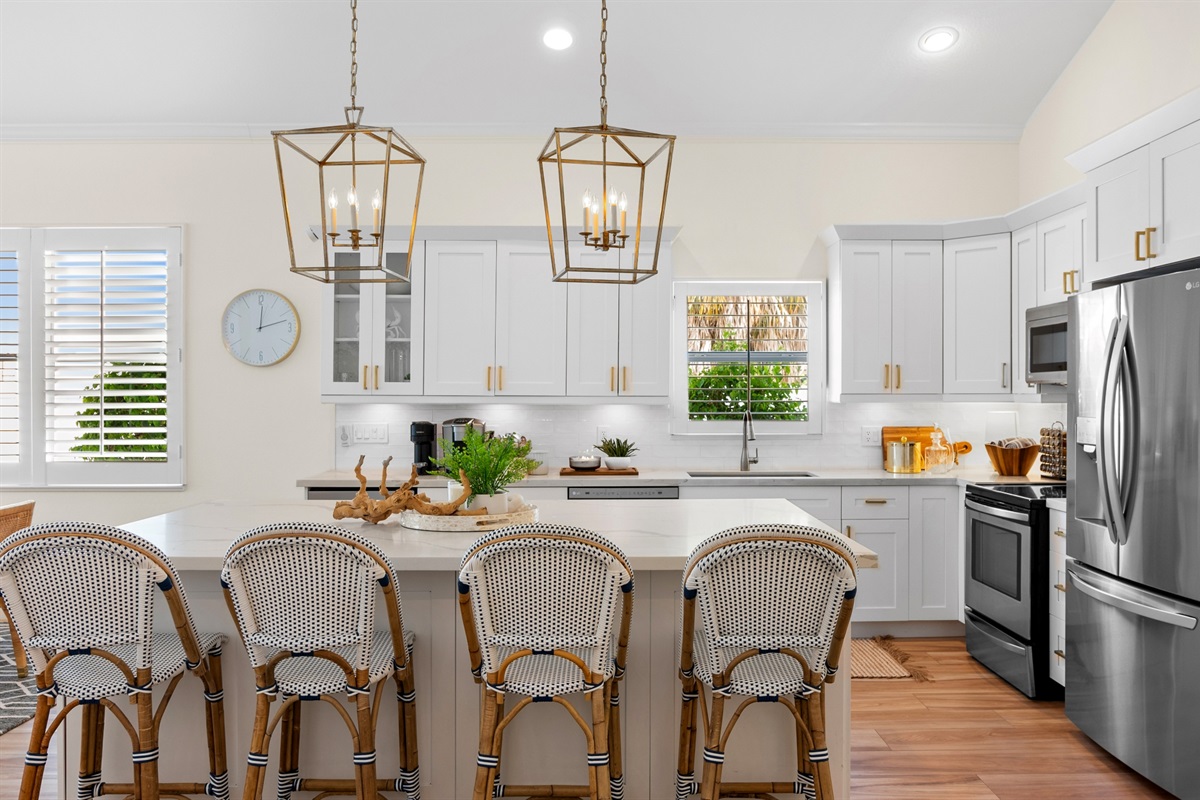 Fully Stocked Kitchen w/ Bar Seating and Two Tables!