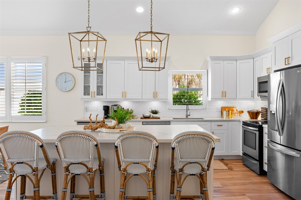 Fully Stocked Kitchen w/ Bar Seating and Two Tables!