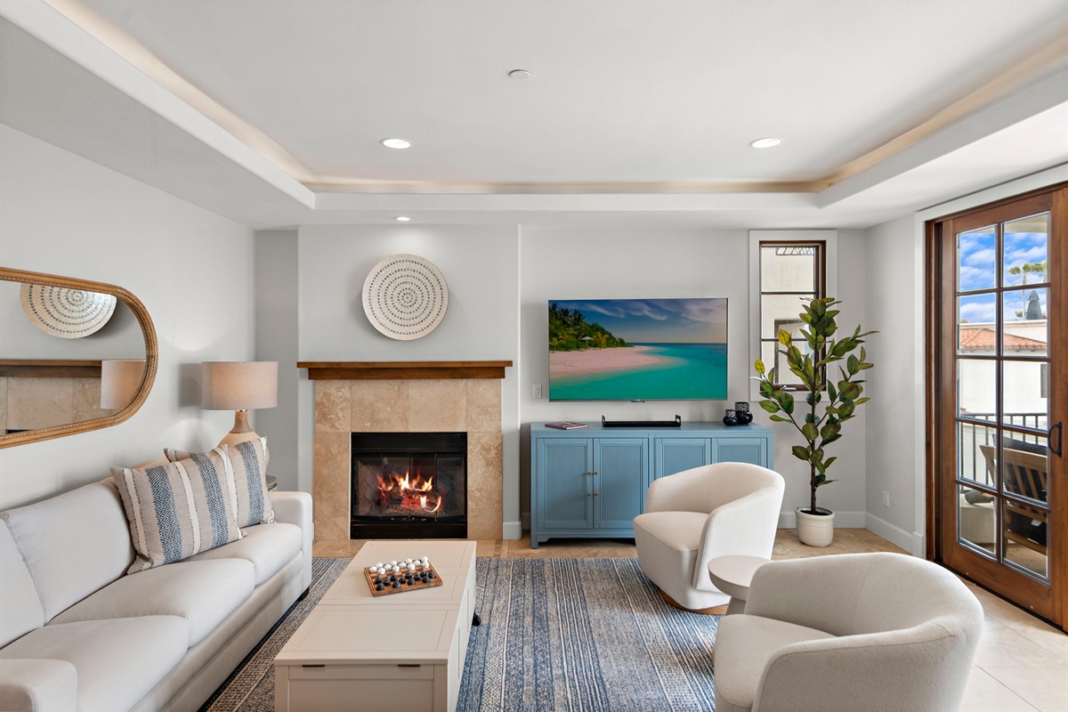 Enjoy the cozy fireplace while you watch your favorite shows on a 65" smart TV (to the left of the fireplace).  We offer Amazon Prime, Sling TV, Peacock, Hulu, Disney, Max and Paramount plus as well as over 300 movies in our amazon library.