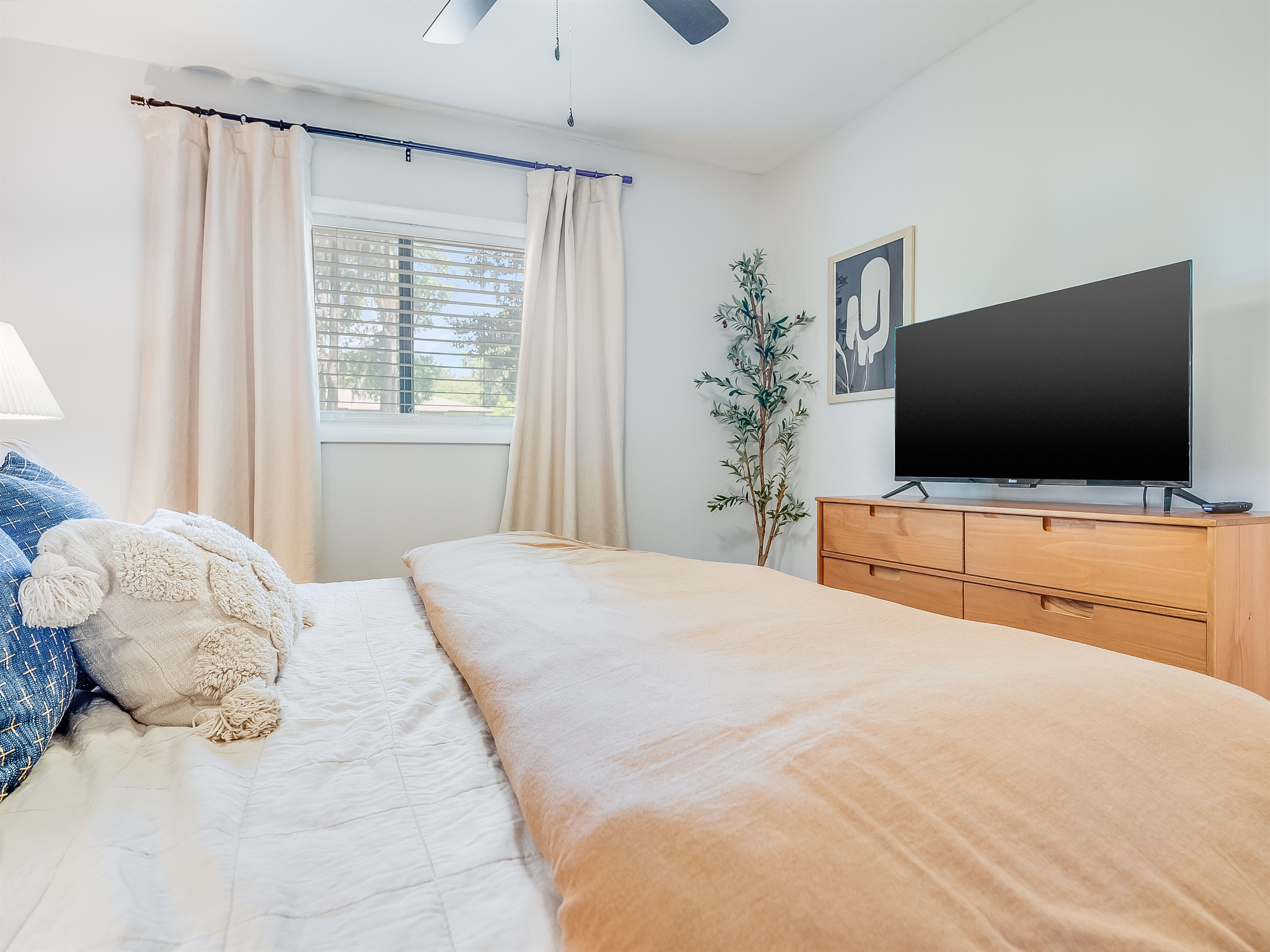 Catch up on your shows from the comfort of your queen bed.