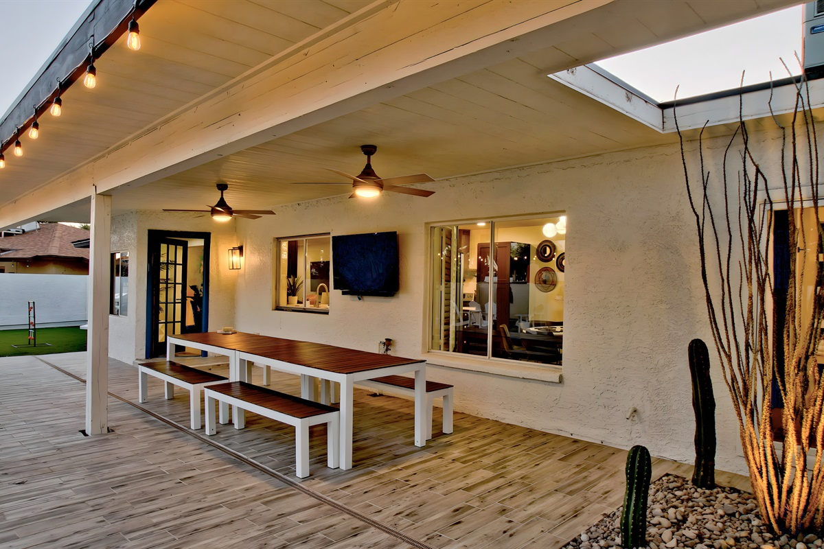Large al fresco dining table with TV
