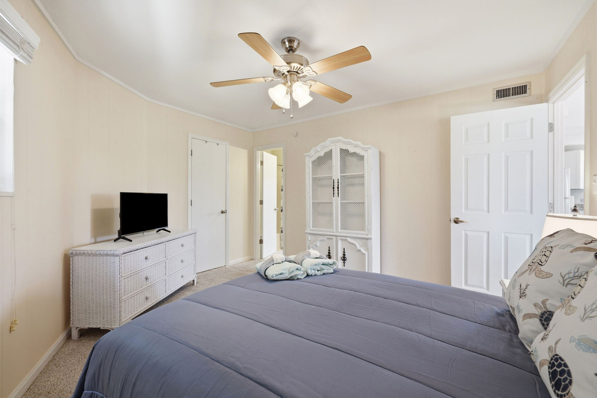 Bright and inviting 2nd bedroom with a double bed, Smart TV, and plenty of storage