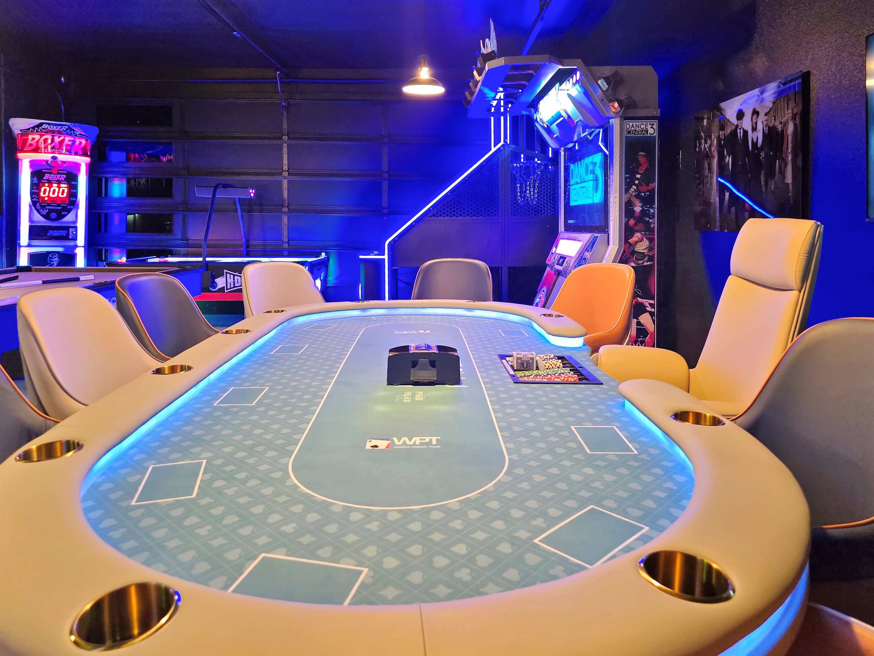 Ultimate game room featuring Vegas style poker table with 10 leather chairs. 