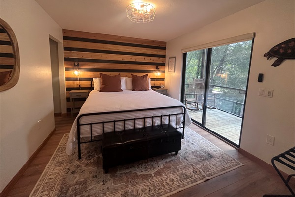 Downstairs bedroom is fitted with a king size bed, Roku TV & sliding doors to the balcony.