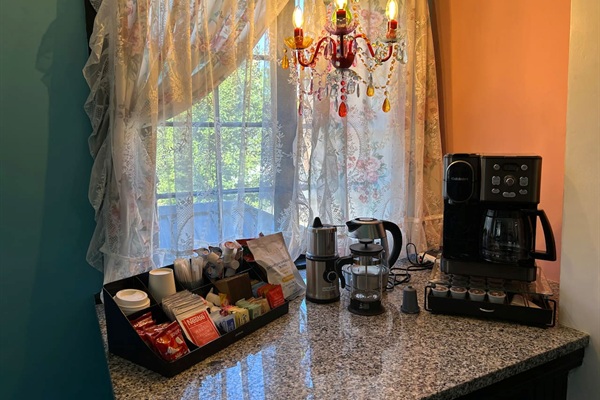 Fully stocked coffee, tea, hot chocolate station,