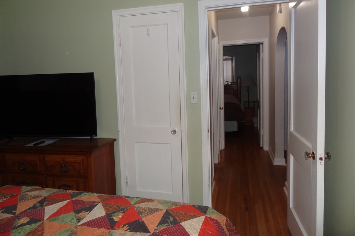 2nd bedroom with queen bed and Roku smart TV