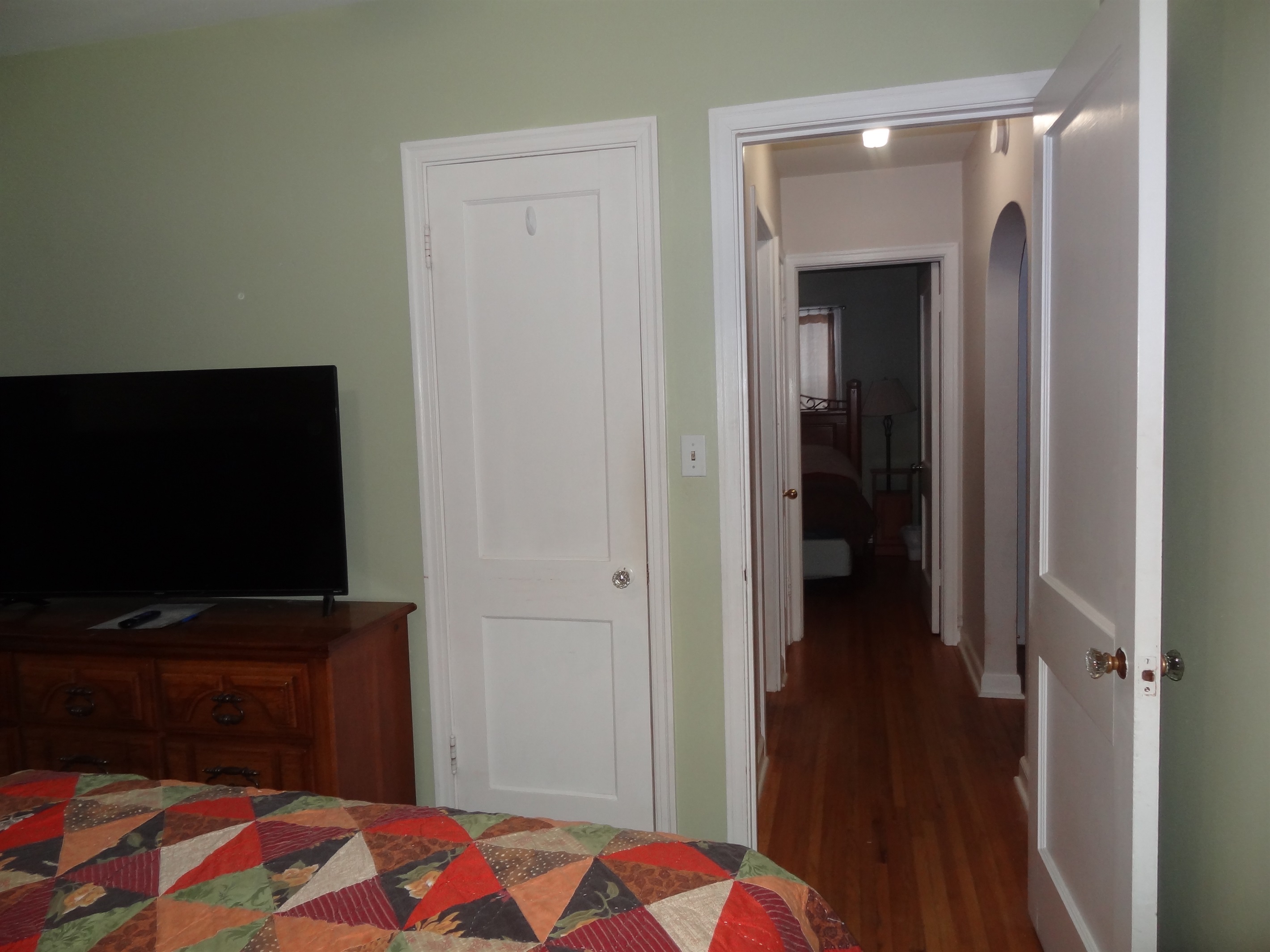 2nd bedroom with queen bed and Roku smart TV