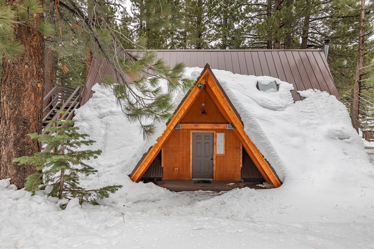 The snow looks beautiful in this A-frame style house