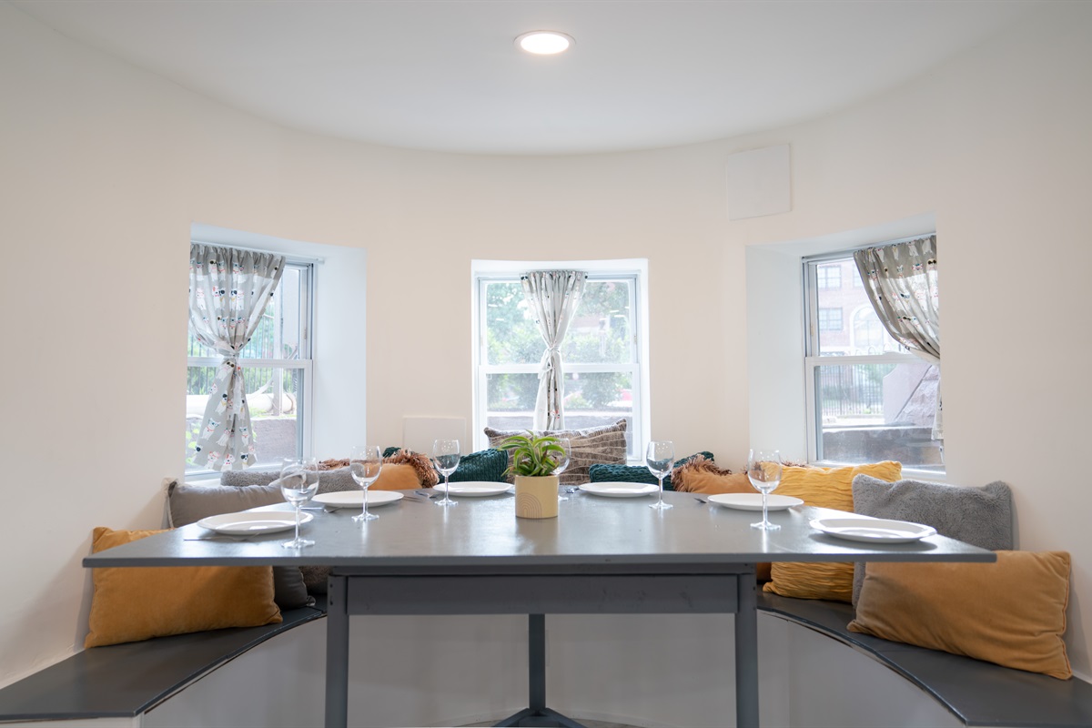 The lower level dining nook is just off the living room and can fit up to 6 people. The stools from the kitchen island can also be used at the dining nook for additional seating