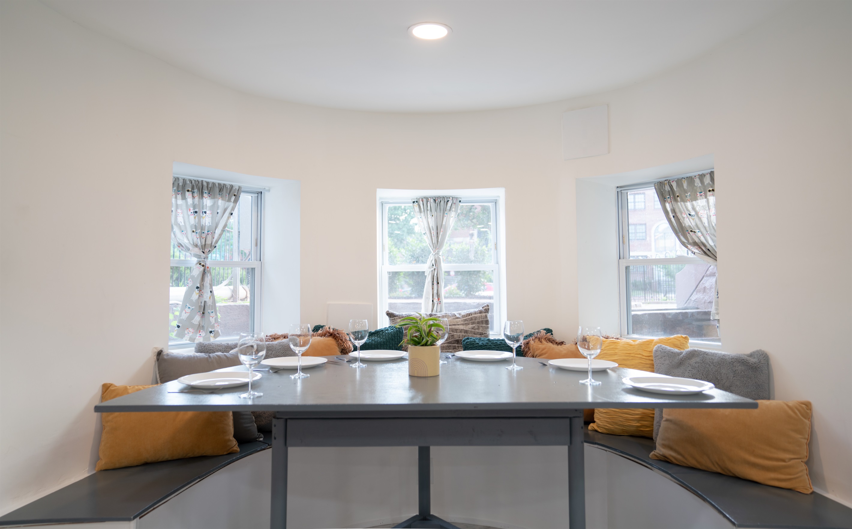 The lower level dining nook is just off the living room and can fit up to 6 people. The stools from the kitchen island can also be used at the dining nook for additional seating