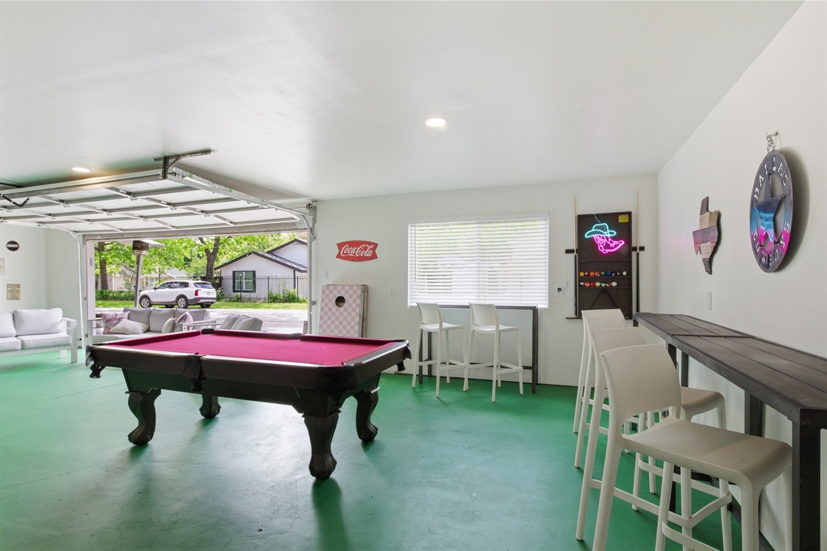 Pool Table and bar seating in the 1,000 sq ft Garage Game Room. Premium game room setup for group trips and sports weekends.