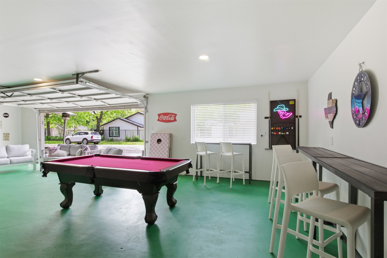 Pool Table and bar seating in the 1,000 sq ft Garage Game Room. Premium game room setup for group trips and sports weekends.