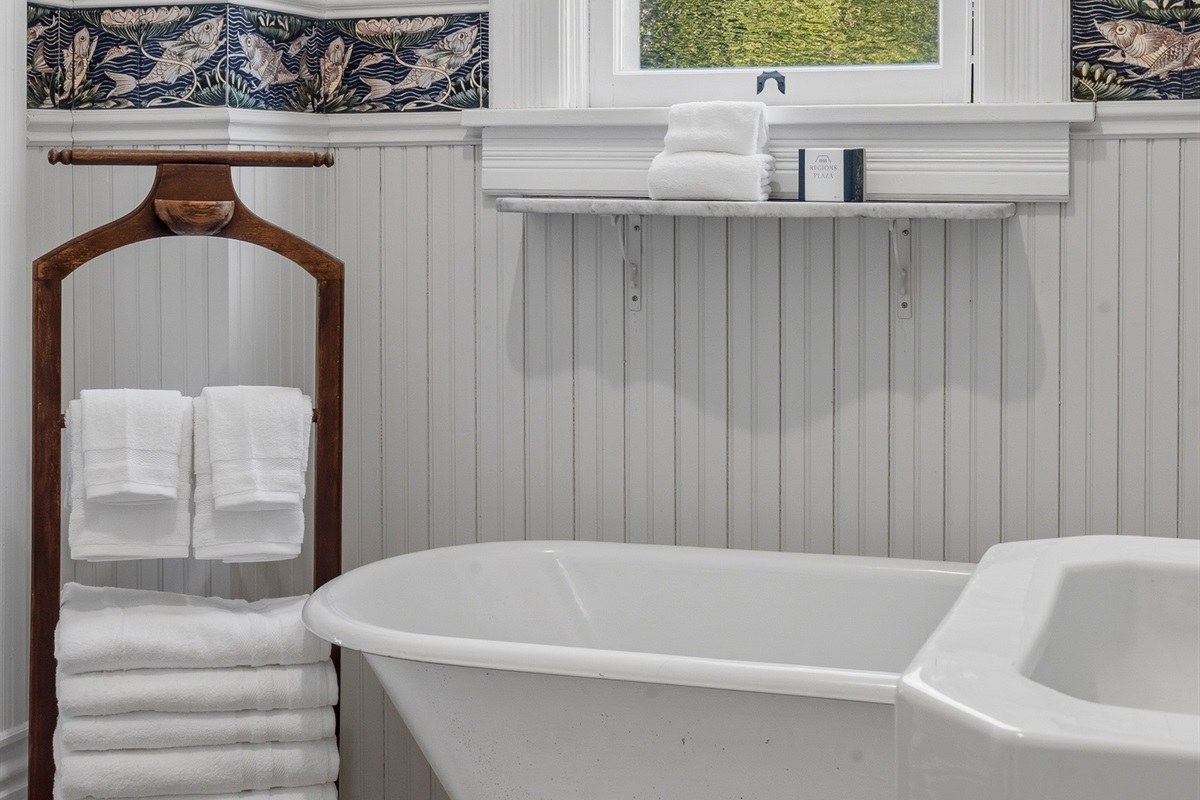 Bathroom amenities neatly arranged beside the sink