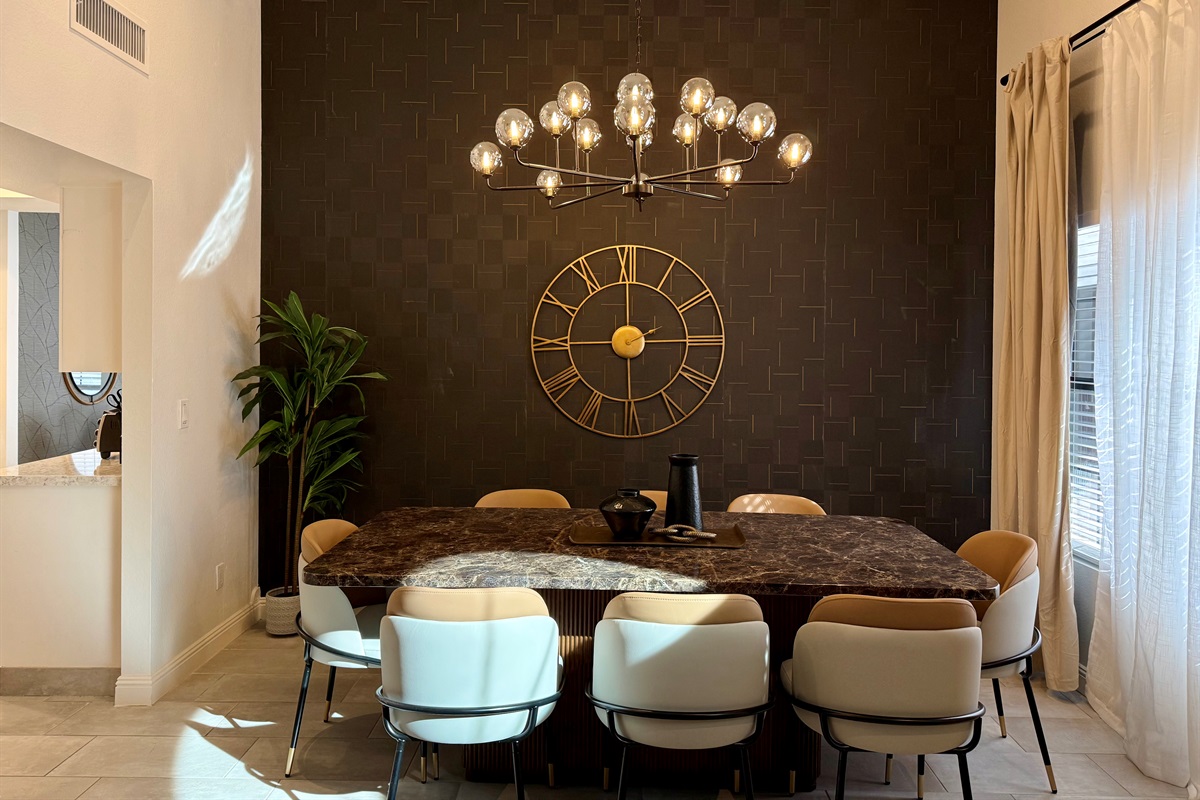 Formal dining overlooks the beautiful pool